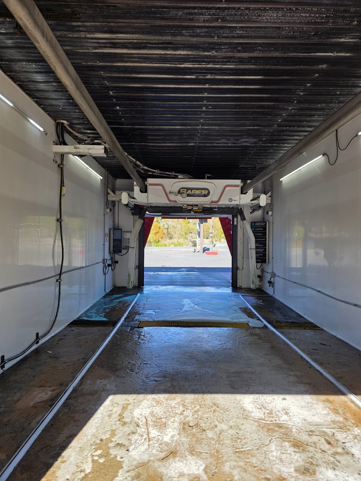 Inside the Saber touchless bay at Lanco — nothing touches the car but soap and water